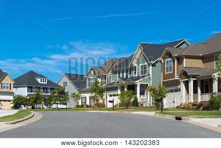 Street of suburban residential houses with porches