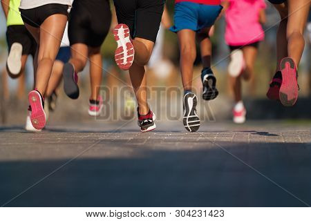 Running Children, Young Athletes Run In A Kids Run Race,running On City Road Detail On Legs,running 