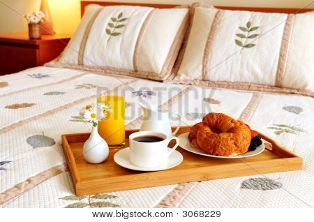 Breakfast On Bed In A Hotel Room