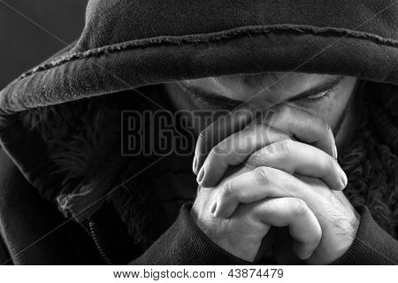 Despair bandit praying God for forgiveness