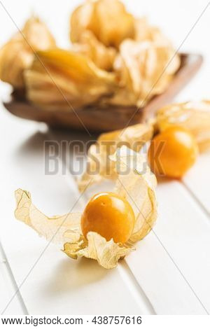 Physalis peruviana. Cape Gooseberry or ground cherries fruit on white table.