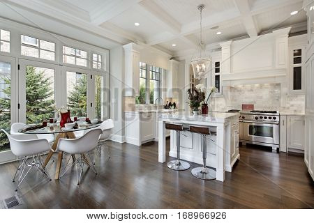 Kitchen in luxury home with white cabinetry.