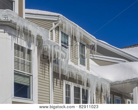 Ice dams and snow on roof and gutters