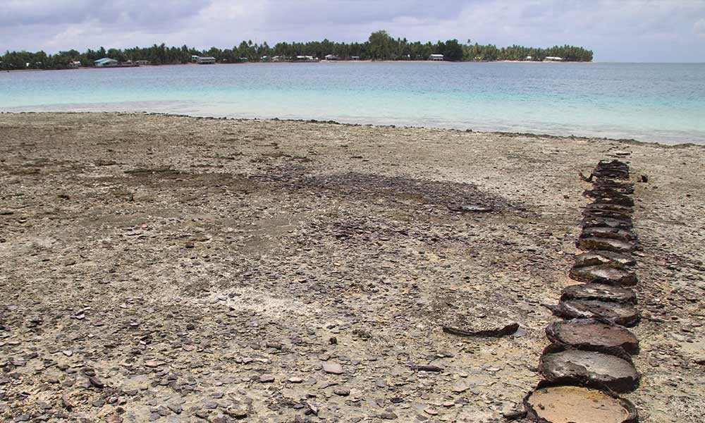 Drums filled with sand, used as boat anchorage, Nanumea Island, Tuvalu. Photo: UNDP