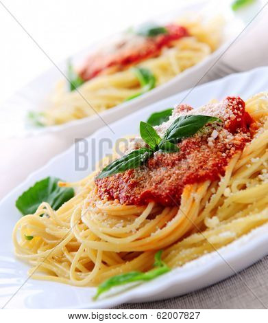 Pasta with tomato sauce basil and grated parmesan