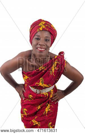 Beautiful African Woman Wearing A Traditional Clothes, Looks At The Camera And Smiles, Isolated On W