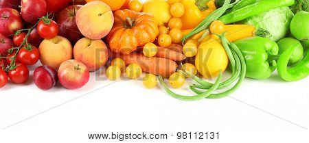 Heap of fresh fruits and vegetables  isolated on white