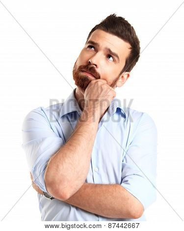 Thinking man isolated on white background. Closeup portrait of a casual young pensive businessman lo