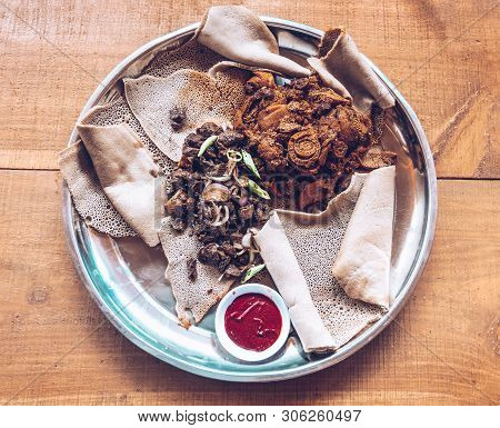 Injera Food, Traditional And National Dish Of Ethiopia And Eritrea. Meal Consisting Of Injera And Se