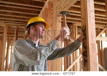 Construction Man Using Hammer