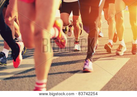 Marathon running race, people feet on city road