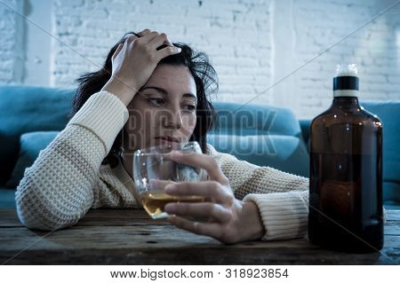 Young, Sad, Unhappy, Helpless Woman Drinking Alcohol. Human Emotions, Alcoholism And Addictions