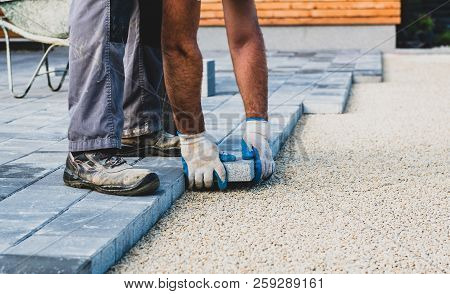 Laying Gray Concrete Paving Slabs In House Courtyard Driveway Patio.