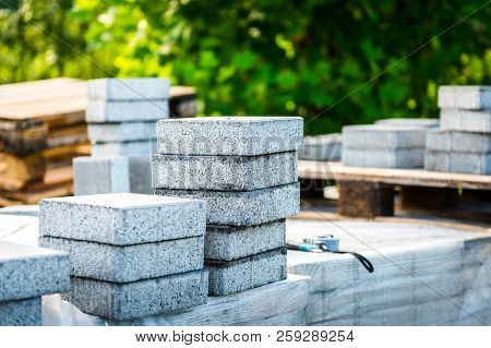 Stack Of Concrete Paving Slabs Tiles Ready For Laying Pavement.