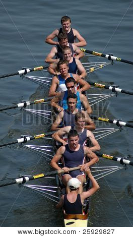 Junior rowing team rowing ahead during a boat-race on the River Vltava in Prague, Czech Republic.