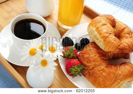 Breakfast served on a tray on a sunny morning