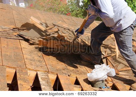 Demolition and removal of an Old Asphalt Single roof that was installed over an old Cedar Shake Roof from the 1960's era. Roofs generally last about 20 years before needing to be replaced. 