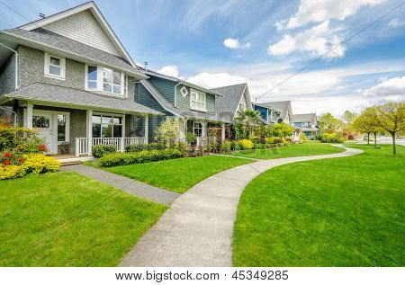 A perfect neighborhood. Houses in suburb at Spring in the north America