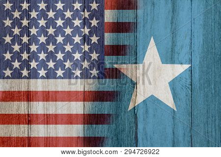 Relationship Between The Usa And Somali, The Flags Of Usa And Somali Merged On Weathered Wood