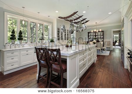 Kitchen in luxury home with white granite island