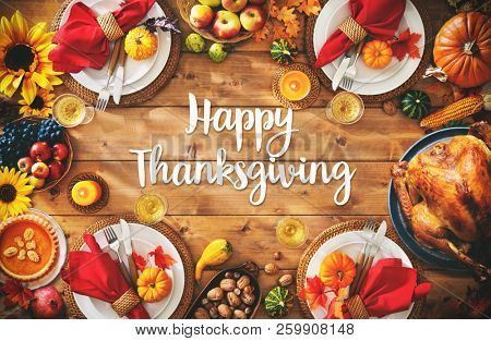 Thanksgiving celebration traditional dinner setting meal concept with Happy Thanksgiving text