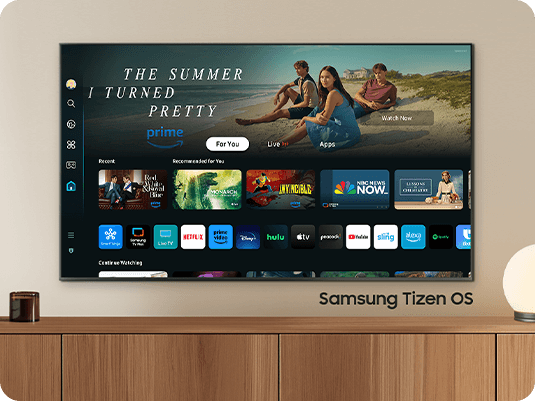 The 2024 Samsung OLED TV displays various free channels and streaming content on the Samsung Tizen OS home screen.