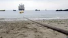 A subsea cable runs across the beach and into the ocean in Chile.