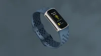 Fitbit Charge 5 tracker, with deep sea sport band, showcasing an on-wrist exercise mode with progress of Active Zone Minutes logged.