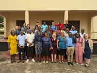 A group of Googlers and teachers stand together for a photo in Kenya