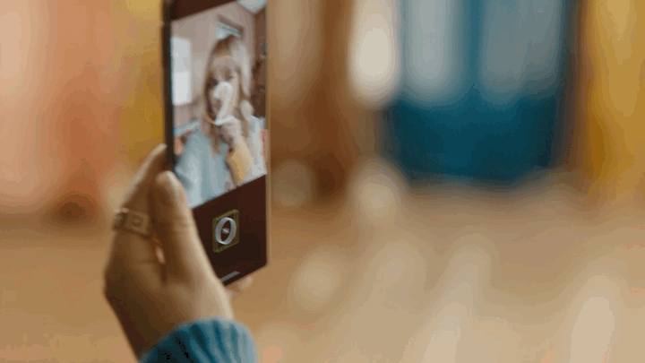 A person taking a selfie with a screen reader enabled