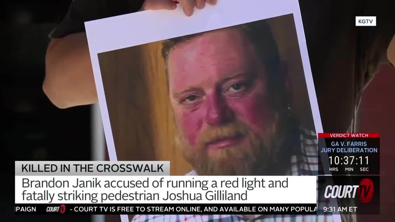 Someone holds up a Polaroid-style photo of a middle-aged, bearded, red-headed man in a plaid shirt.