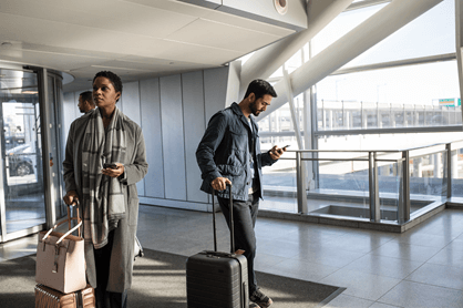 A photo of people at an airport.