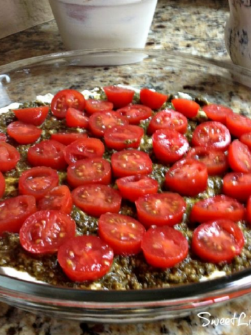 This image shows Caprese Dip in a pie plate before baking.