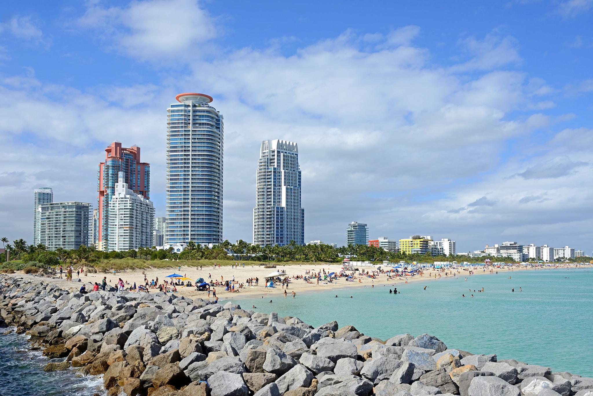 a beach with a group of buildings