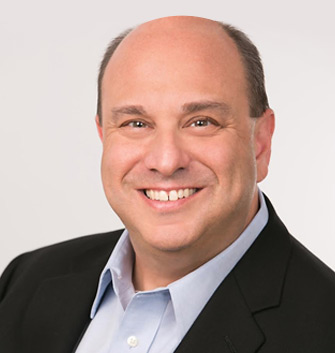 headshot of man with blazer