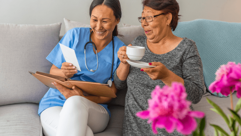 Carer with Individual Connecting with Tea and Photos