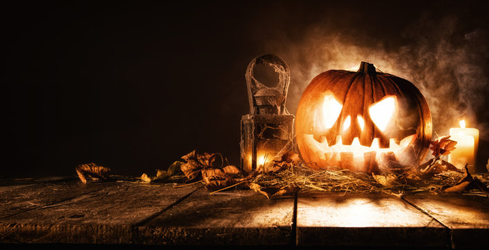 Scary halloween pumpkin on wooden planks