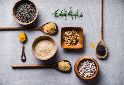 Different dried food groups on concrete background.