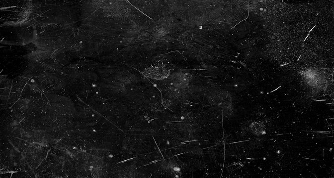 Black scratched grunge background, old film effect, space for text