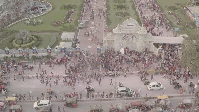 Color battle at the holi festival in India, Vrindavan, 4k aerial shot [Ungraded/flat]