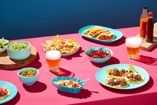 Party table with beer and Mexican food