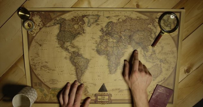 Cultured Man Wants To Go To India On Old Antique Map From Birdseye View With Passport And Classic Magnifying Glass