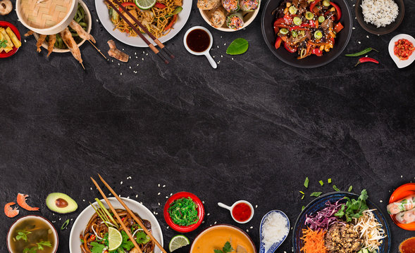 Asian food background with various ingredients on rustic stone background , top view. Vietnam or Thai cuisine.