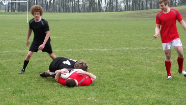 Rugby Match. Two teams on the rugby field battling for the ball. 