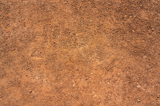 Dirt, terrain or gravel stone road surface pattern in outdoor environmental. Background and textured photo.