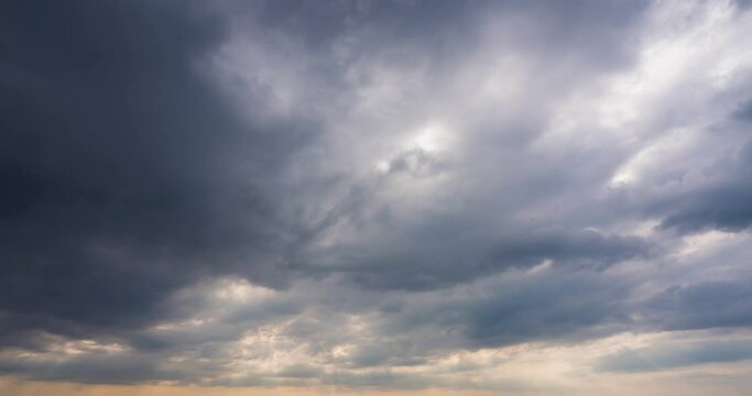 dramatic sky with stormy gray clouds, Hurricane rainy weather nature background. Dark gray sky at sea. B roll footage of Cloudscape screen. Cloudy evening at sea coast. Windy weather summer.4K sunset