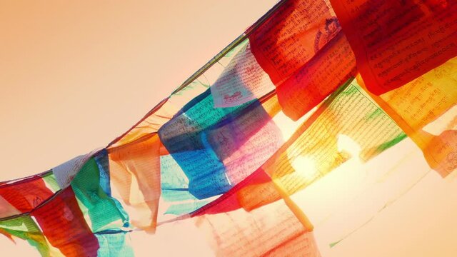 Wind Blows Prayer Flags At Sunset