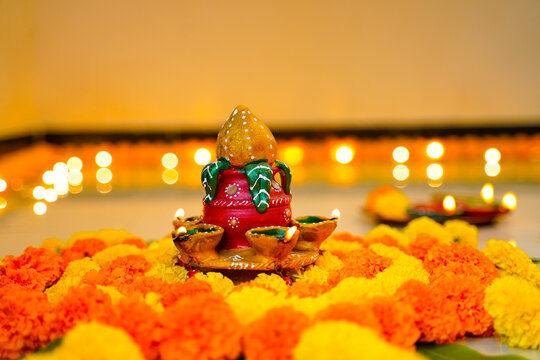 Colorful marigold flower decoration with traditional oil lamp for diwali festival