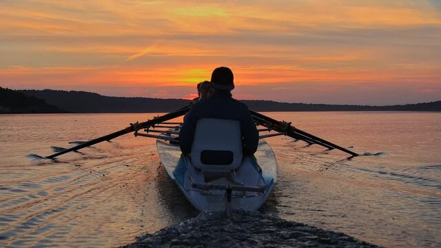 rowing in the canoe on sunset, Ayvalik Turkey slow motion. High quality FullHD footage