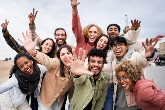 Big group of cheerful young friends taking selfie portrait. Happy people looking at the camera smiling. Concept of community, youth lifestyle and friendship